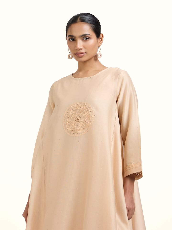 Angled view of the Beige Chanderi Cotton Silk Chikankari Kurta