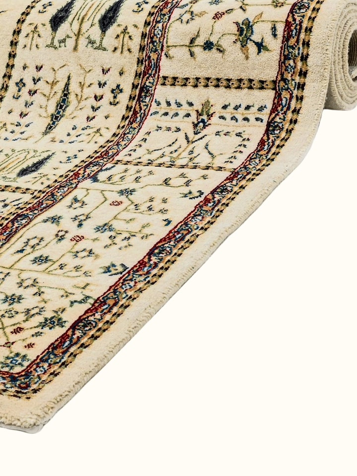 Detail view of Traditional Persian Ivory Tree of Life Bhadohi Wool & Bamboo Silk Hand Knotted Rug highlighting the intricate pattern and pile texture