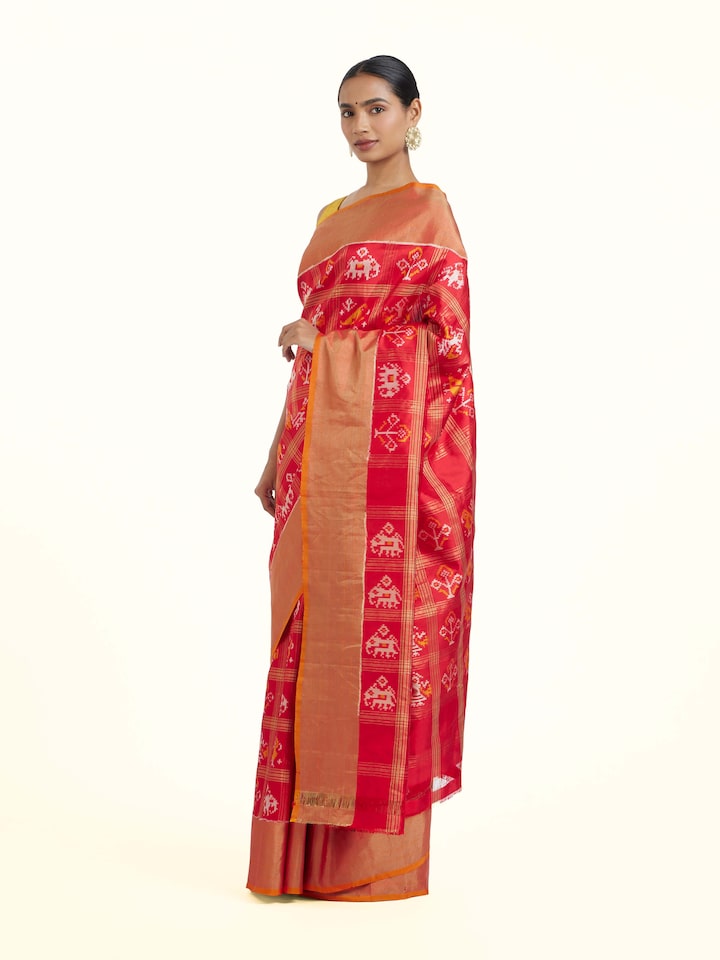 Side view of Red Pochampally Ikat Silk Saree highlighting the detailed craftsmanship and elegant silhouette
