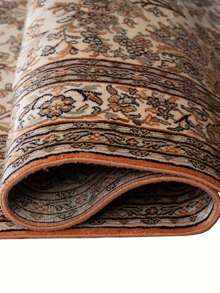 Detail view of Traditional Persian Ivory Mahal Kashmir Silk Hand-Knotted Carpet highlighting the intricate pattern and pile texture, from a differe...