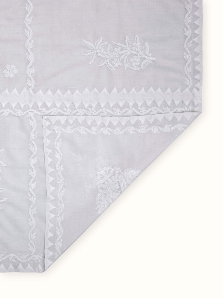 Back view of Ananda white medallion Chikankari table cover showing reverse side with clean threadwork finish.