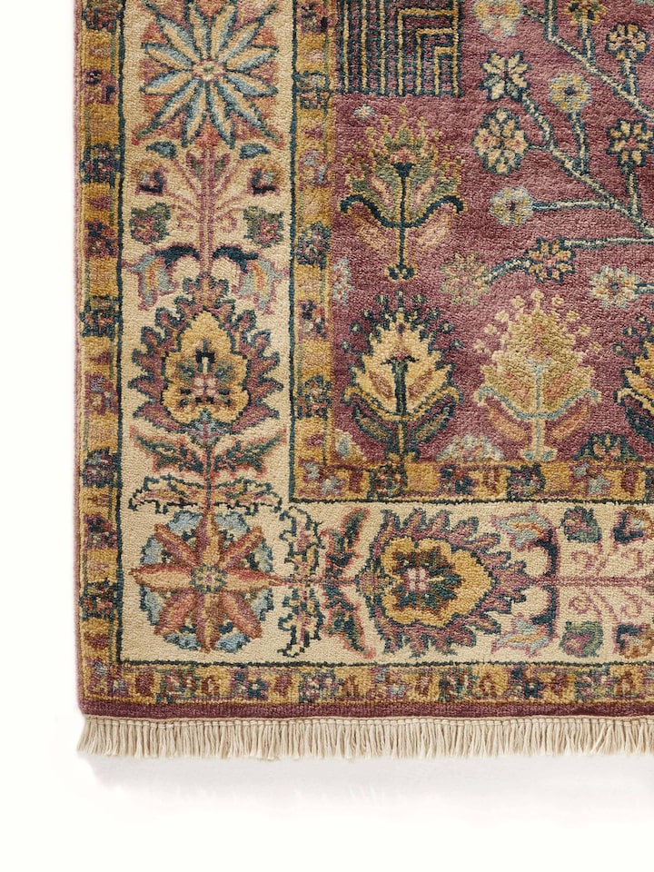Close-up of Ziegler Traditional Light Majenta Jaipur Wool Hand-Knotted Carpet, showing the intricate patterns and wool texture.