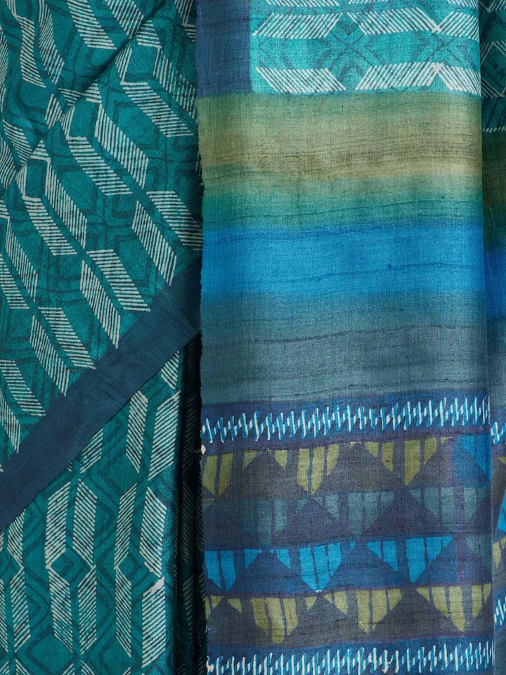 Detailed view of Sea Green Tussar Silk Discharge Block Printed Saree focusing on the fine craftsmanship and texture