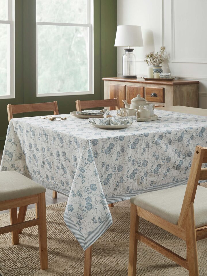 Top-down shot displaying the full table cover spread on a 4-seater table, highlighting the intricate floral design