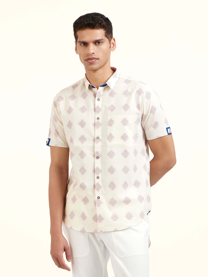 Angled view of white cotton Telangana Ikat shirt emphasizing fabric weave