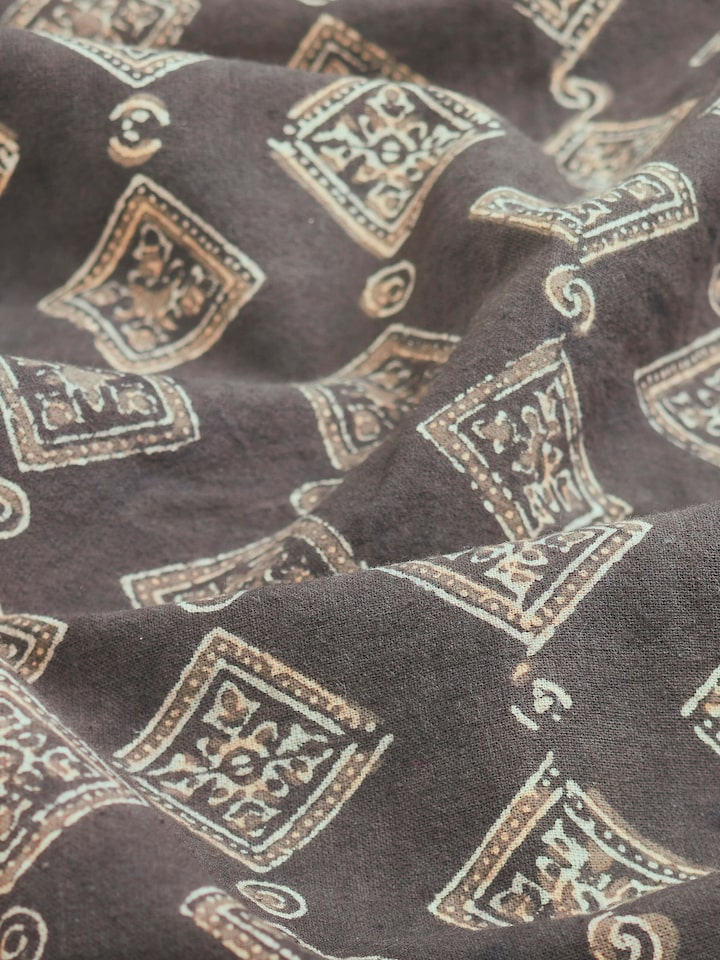 Close-up view of Sindh dark brown jaal cotton ajrakh block printed queen bedspread set (3 pcs) emphasizing the texture and intricate design.
