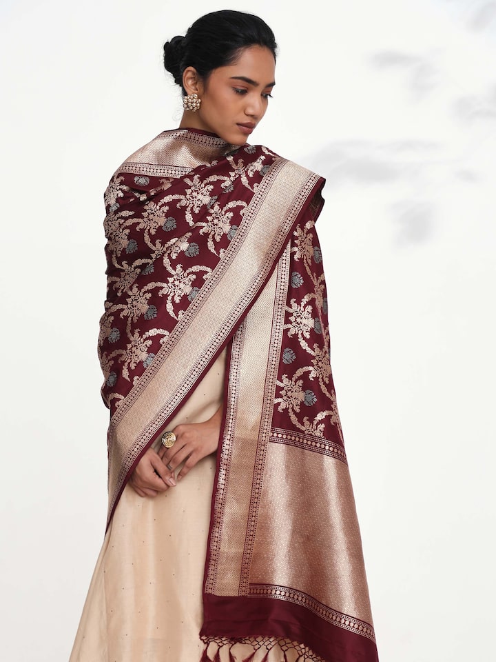Angled view of wine Banarasi silk kadwa jangla handwoven dupatta highlighting jangla patterns