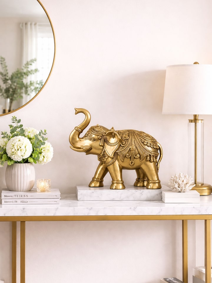 lifestyle view of brass carved elephant figurine with intricate detailing