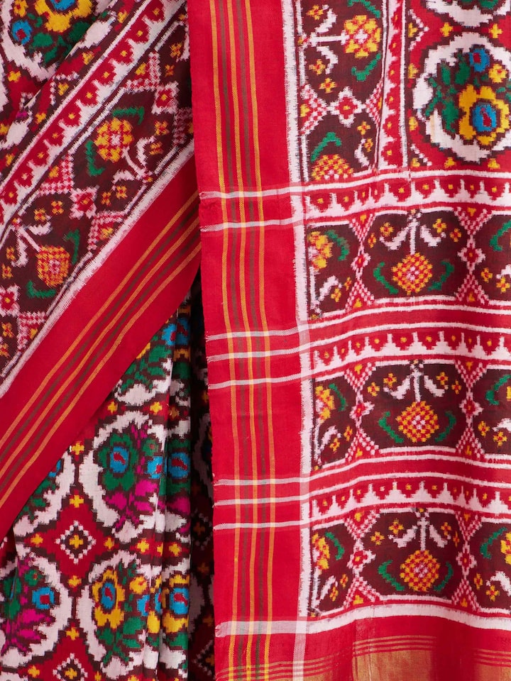 Detailed view of Red Patan Patola Saree focusing on the fine craftsmanship and texture