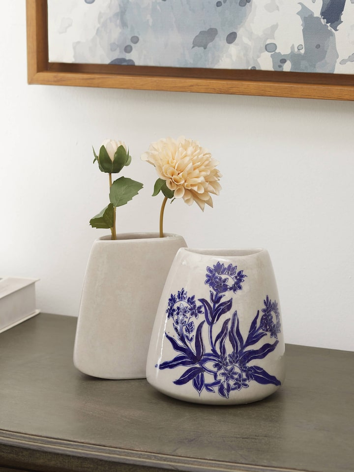 Front view of Blue Pottery Ceramic Floral Table Vases (2 Pcs) from Swadesh, displaying vibrant floral patterns and smooth ceramic finish.