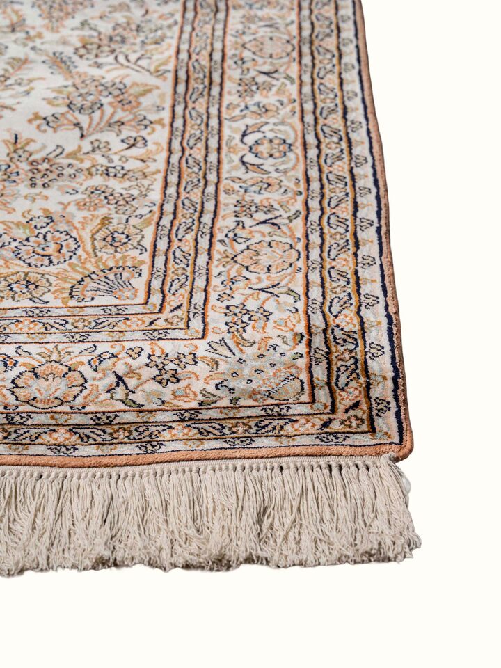 Close-up view of Traditional Persian Ivory Mahal Kashmir Silk Hand-Knotted Carpet highlighting the hand-knotted weave and motif detail