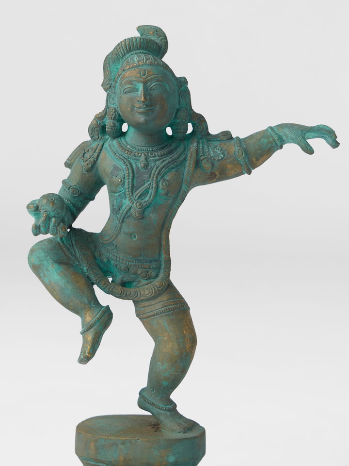 Angled view of the Bronze Cast Butter Krishna Idol