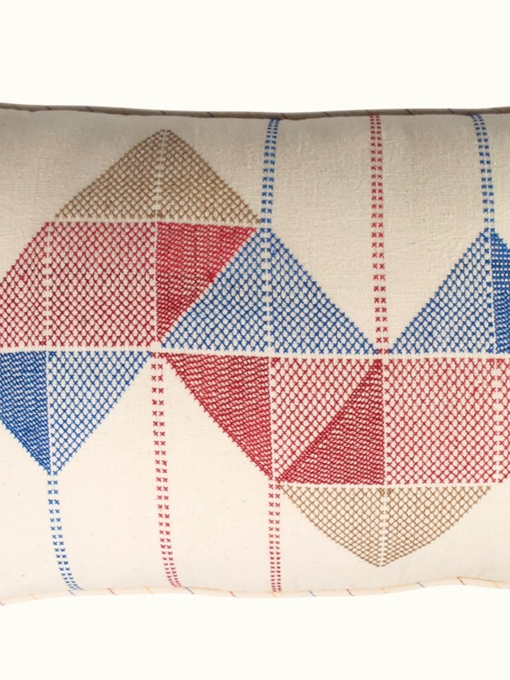 Close-up of Kutch Jat hand embroidery on cotton cushion cover