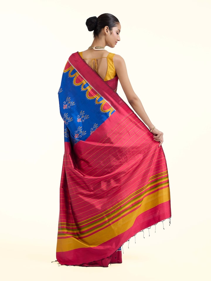 Back view of blue mulberry silk bandha Odisha ikat saree displaying ornate pallu design