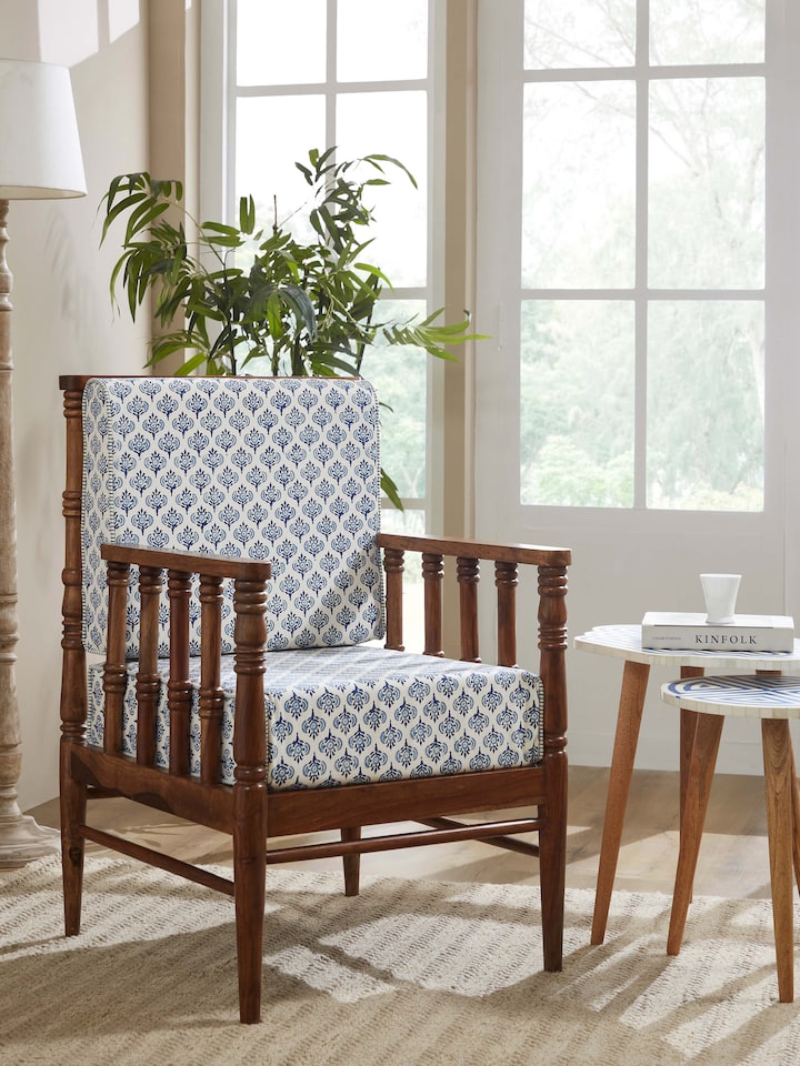lifestyle view of upholstered sheesham wood arm chair