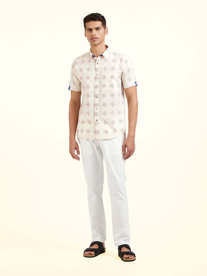 Front view of white cotton Telangana Ikat shirt showcasing traditional ikat motifs