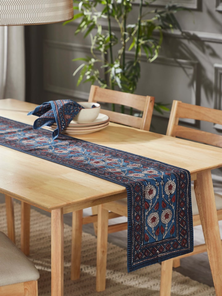 Indigo cotton Dabu hand block printed table runner styled on a wooden dining table
