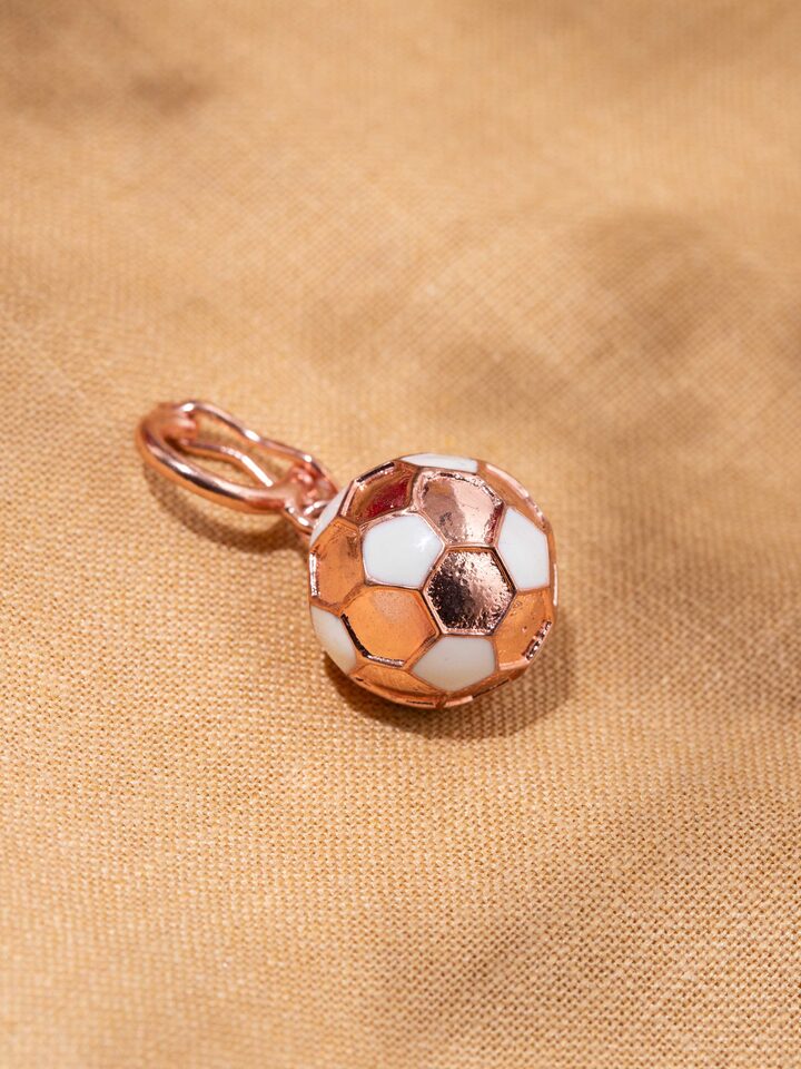 Detail shot of silver pendant revealing delicate handwork and textured finish