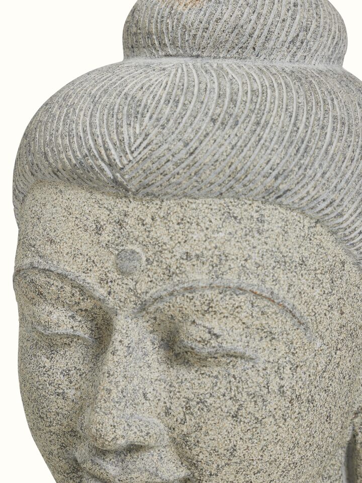 Close-up detail of the Stone Carved Buddha Head Sculpture