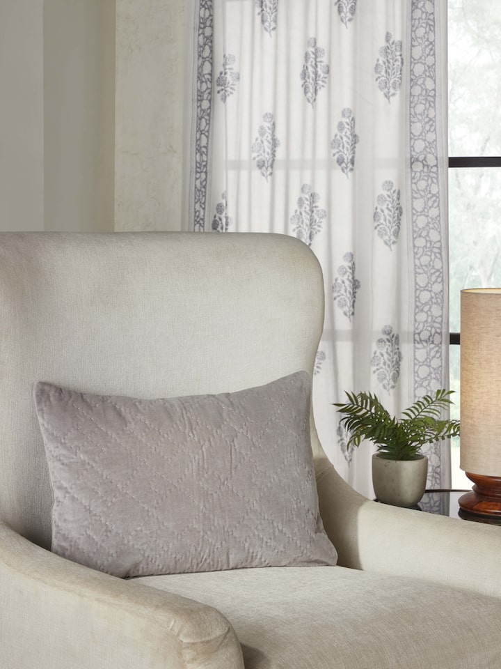 Shivranjini light grey textured lumbar cushion cover styled on sofa – Swadesh
