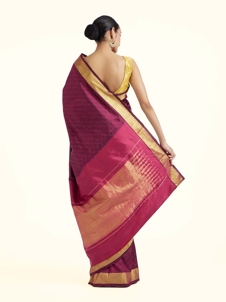 Back view of purple mulberry silk ikat saree displaying patterned pallu design