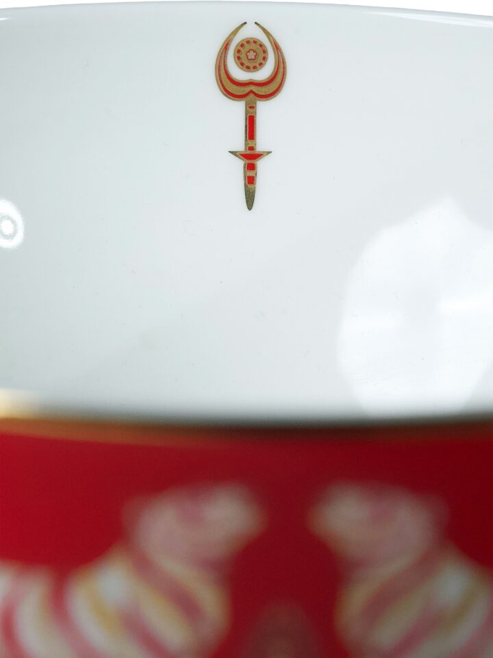 Detail view of Small Ceramic Serving Bowl With Gold Decal Finish. highlighting the handcrafted detailing and finish, in an alternate close-up