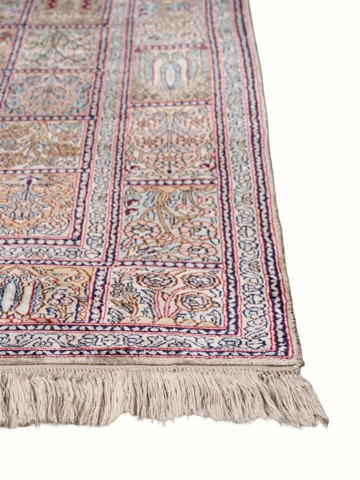 Close-up view of Traditional Persian Rust Dabdar Kashmir Silk Hand-Knotted Carpet highlighting the hand-knotted weave and motif detail