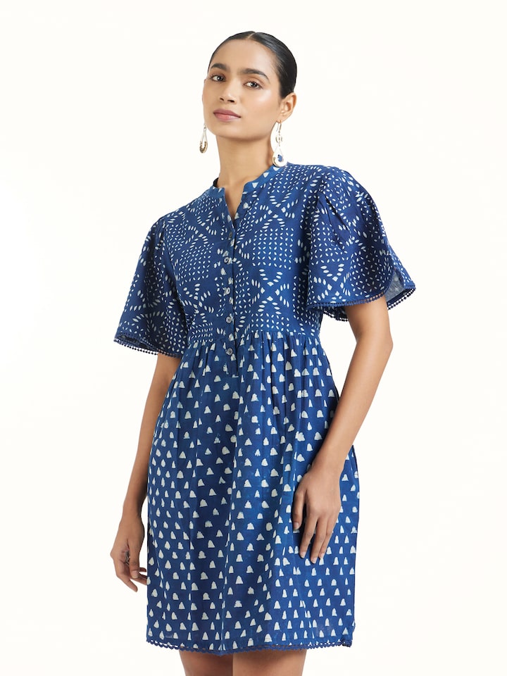 Angled view of Aarnika cotton dabu block printed dress emphasizing block print details