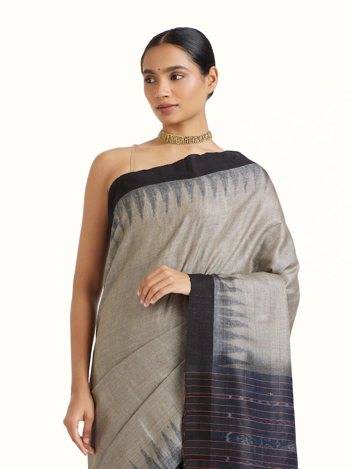 Angled view of Green Tussar Silk Odisha Ikat Saree revealing the depth of its color and intricate pattern