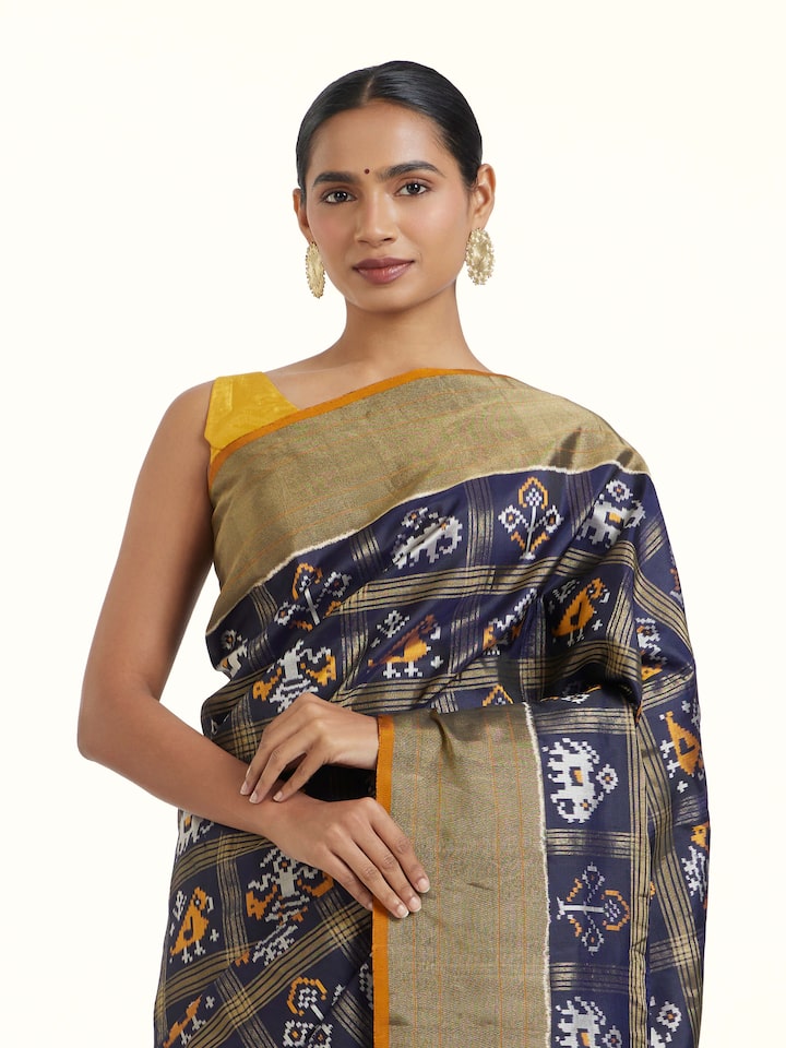 angled view of blue pochampally ikat silk saree