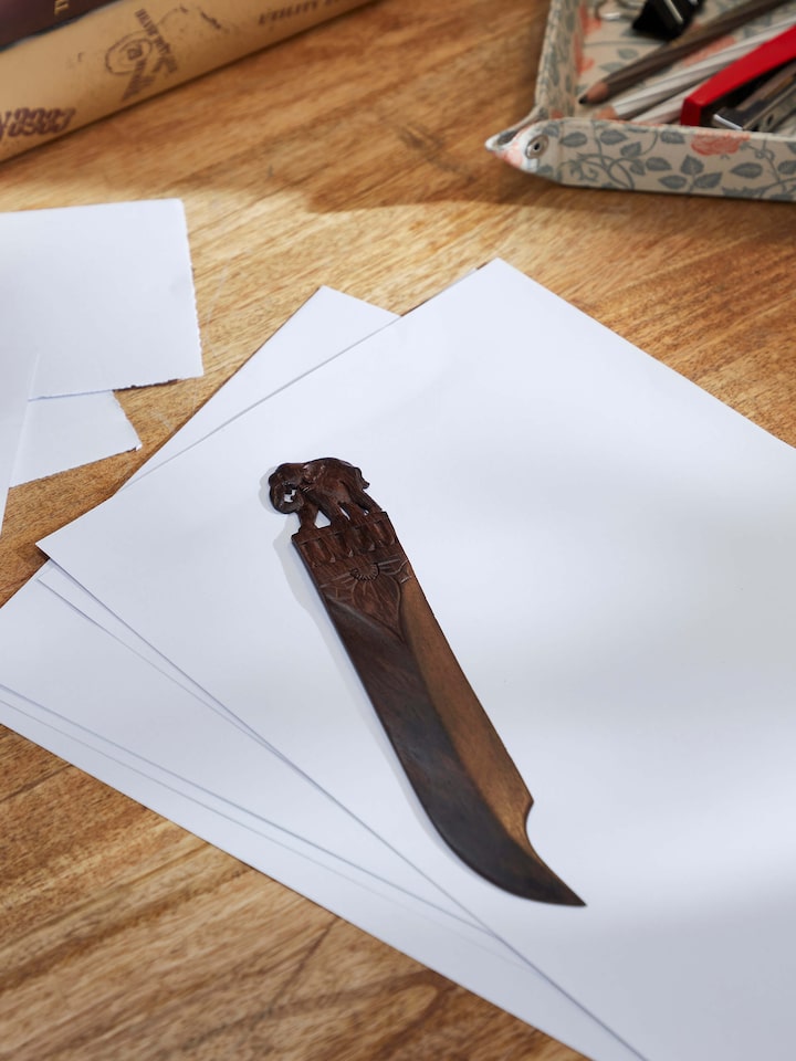Lifestyle view of Carved Rosewood Elephant Paper Cutter