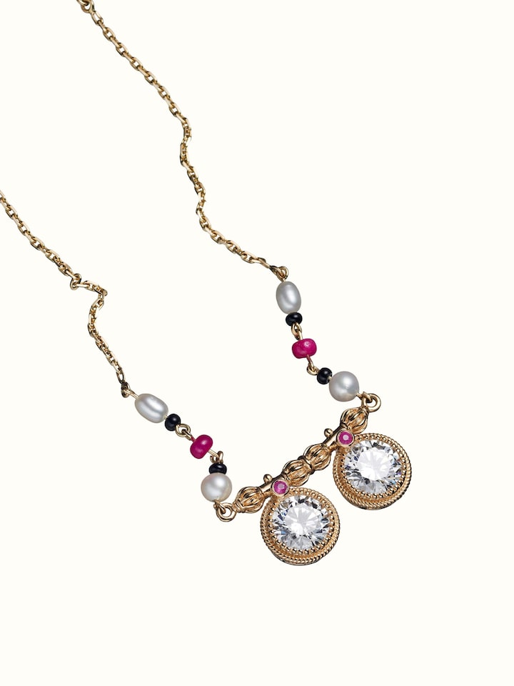 angled view of open setting 14 karat gold mangalsutra
