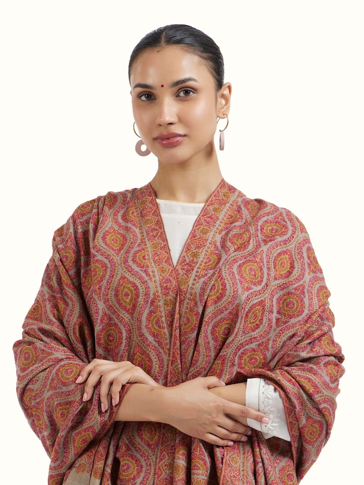 Angled view of Natural Sozni Hand Embroidered Shawl revealing the depth of its color and intricate pattern