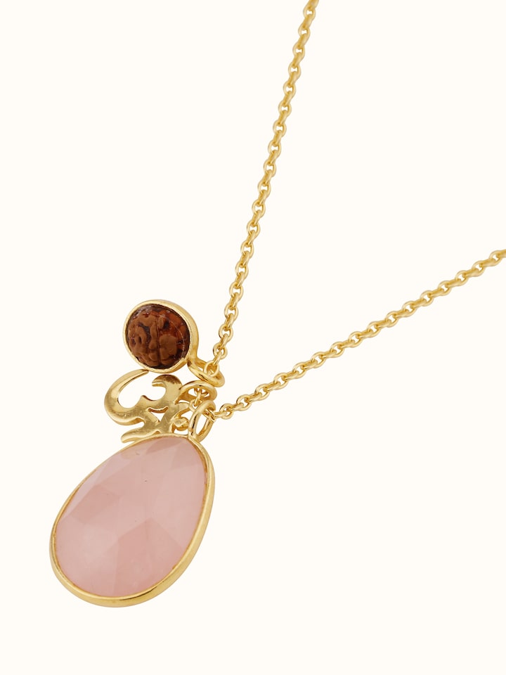 Top view of Rudraksha, Om Charm & Rose Quartz Necklace highlighting the balance of charm placement and overall design