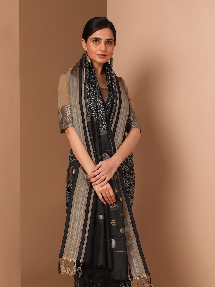 Detail shot showing intricate double Ikat weave and sharp pattern alignment on silk fabric