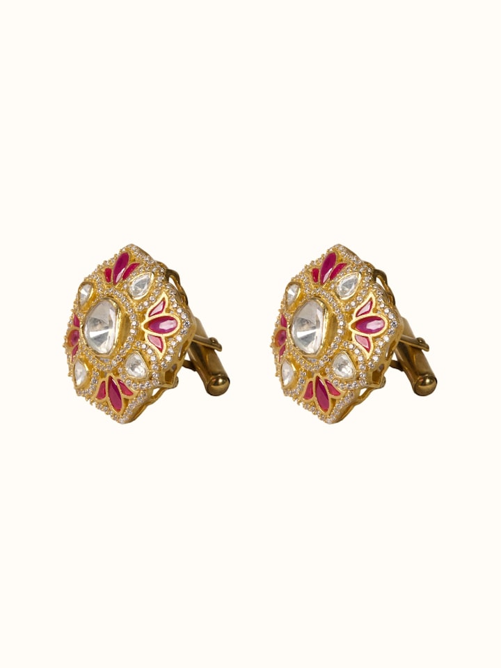 angled view of silver smithing gold plated cufflinks set