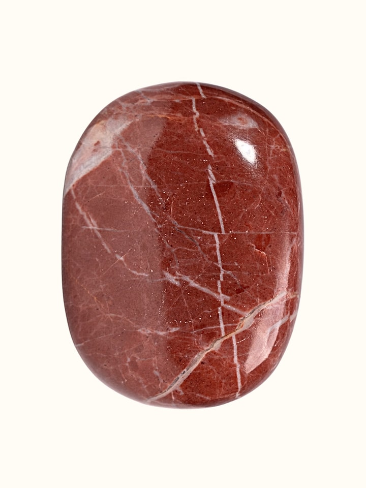 Close-up of the Gemstone Red Jasper Palm Healing Stone texture
