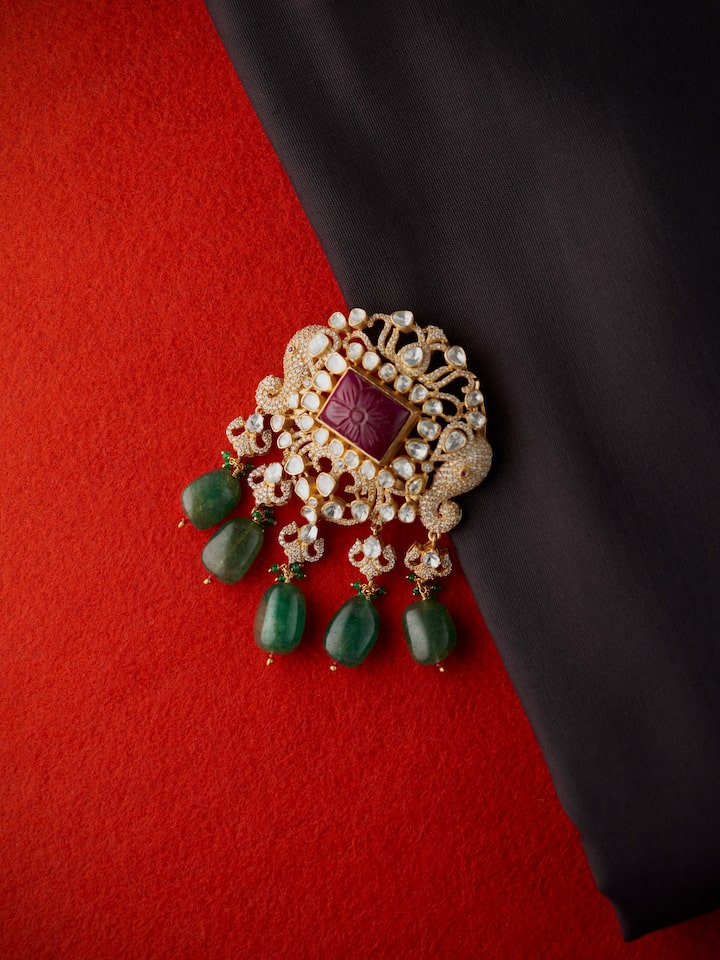 lifestyle view of silver smithing yellow gold brooch pin