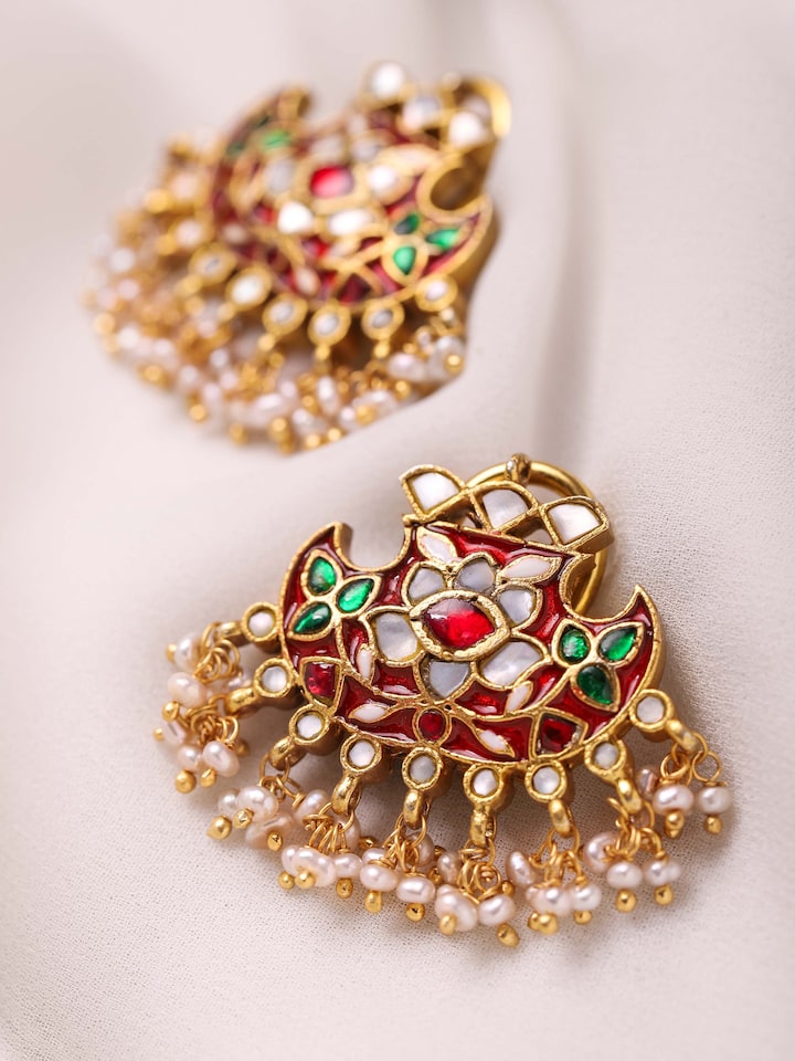 Styled detail view of Silver Smithing Drop Earrings worn on the ear, shown in another styled shot