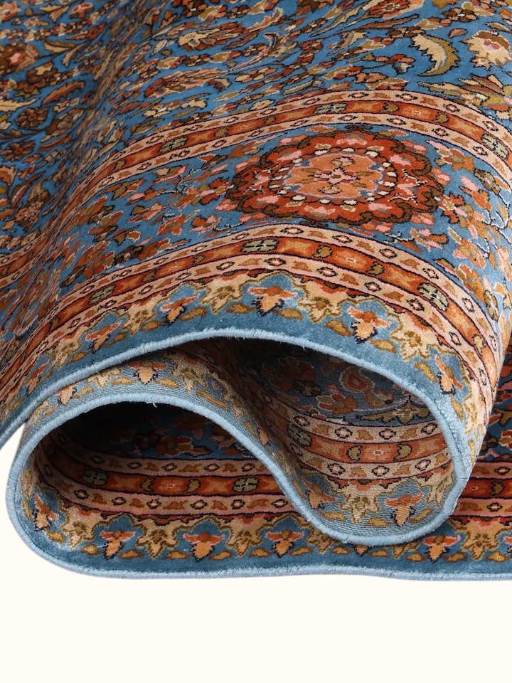 Detailed view of the Traditional Persian Azure Rust Isfahan Kashmir Silk Hand-Knotted Carpet craftsmanship