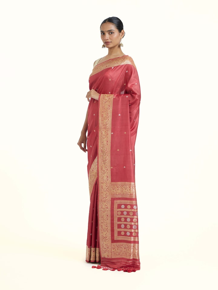 Side view of Pink Ashavali Brocade Silk Saree highlighting the detailed craftsmanship and elegant silhouette