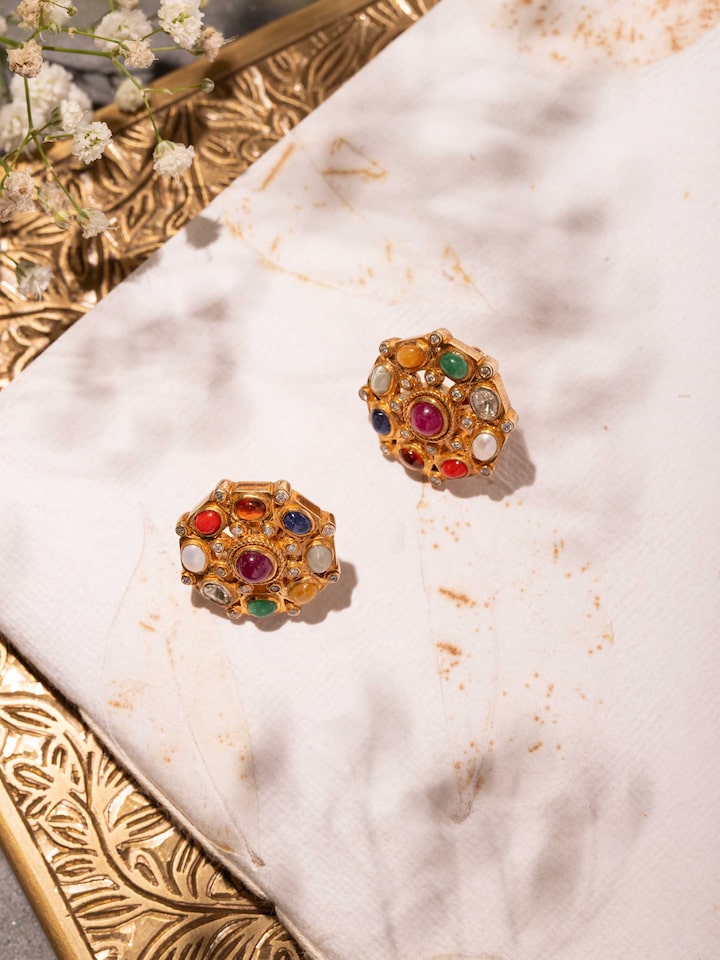 Styled detail view of Navratna Silver Studs displayed, shown in an alternate styled shot