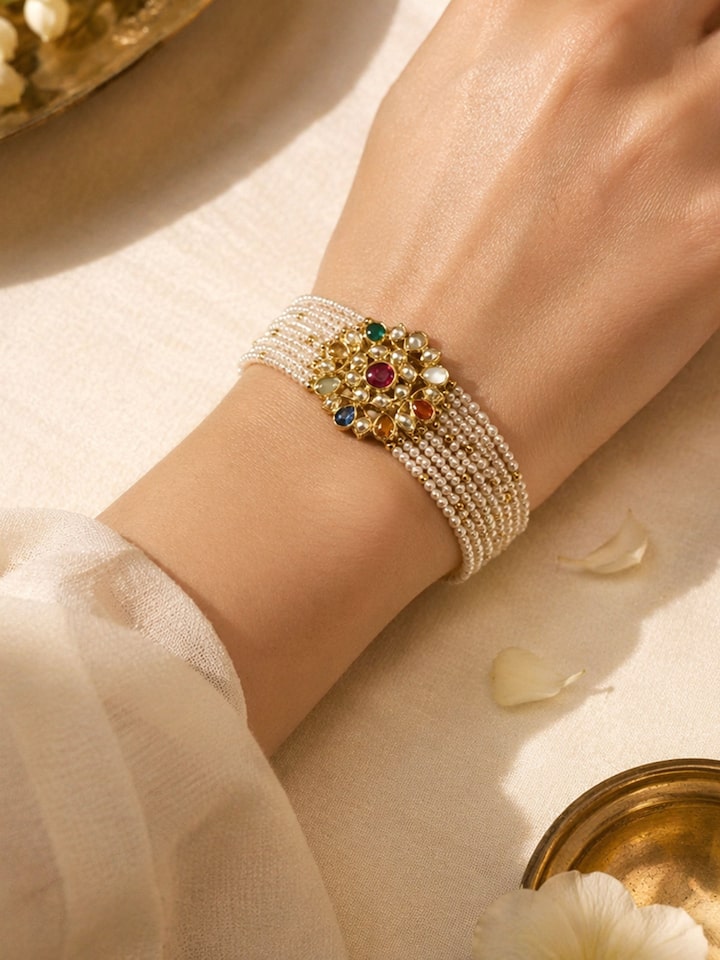 Lifestyle view of the Jadau Navaratna 18 Karat Gold Bracelet