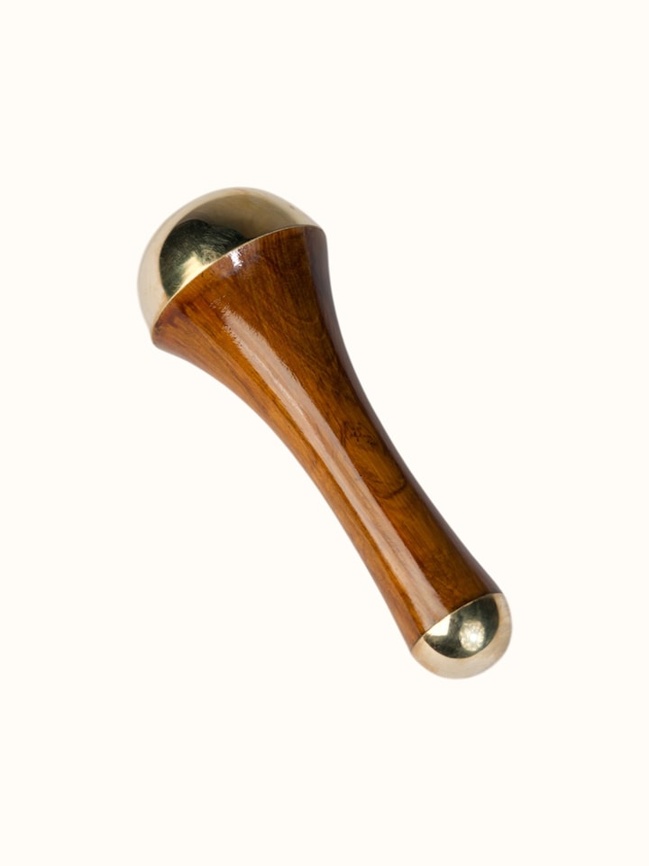 Close-up of the Kansa Wand Ayurvedic Facial and Body Massage Tool