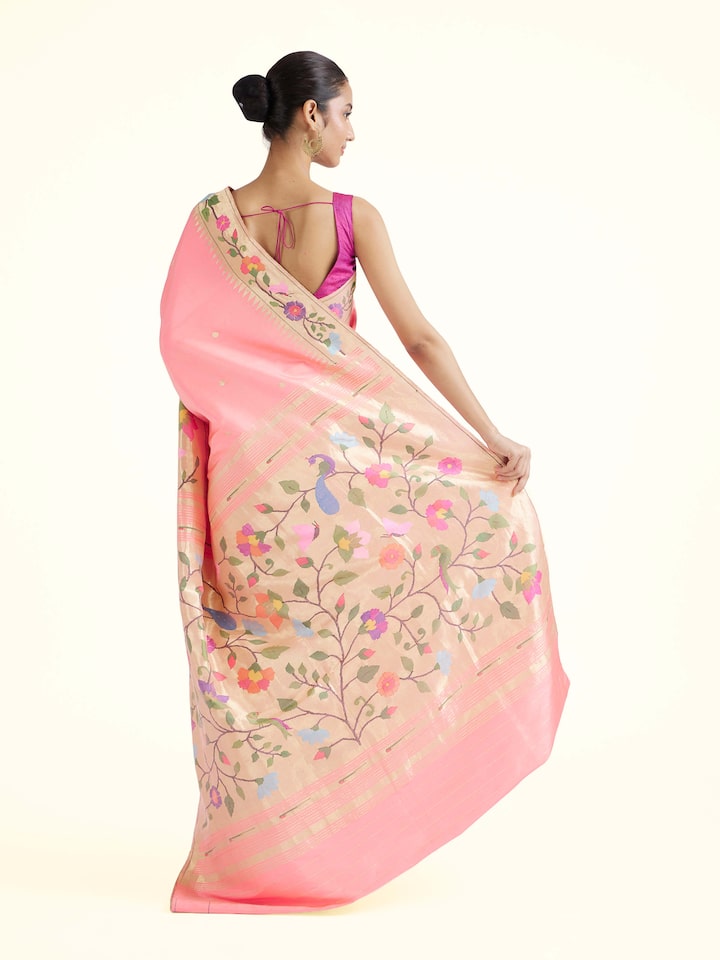 Back view of pink silk Paithani saree displaying ornate pallu