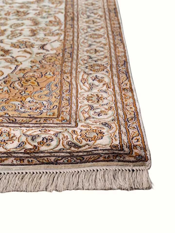 Close-up view of Traditional Persian Ivory Rust Kashan Kashmir Silk Hand-Knotted Carpet highlighting the hand-knotted weave and motif detail