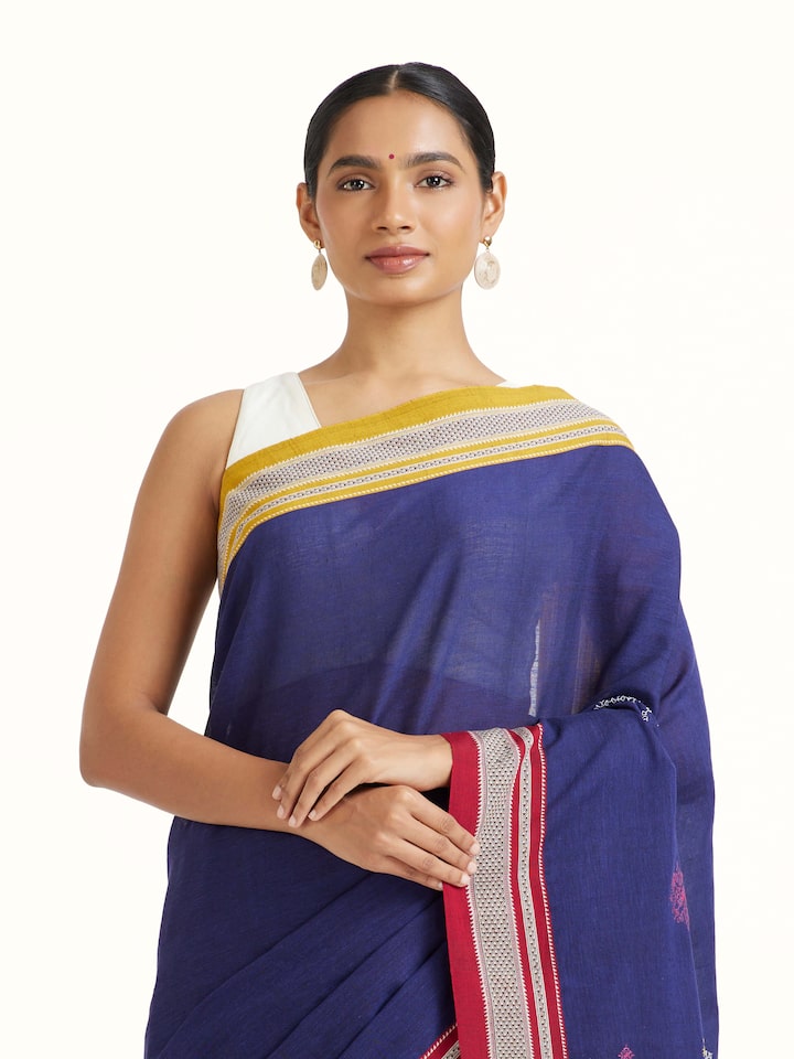 Angled view of Blue Cotton Silk Kasuti Embroidered Saree revealing the depth of its color and intricate pattern