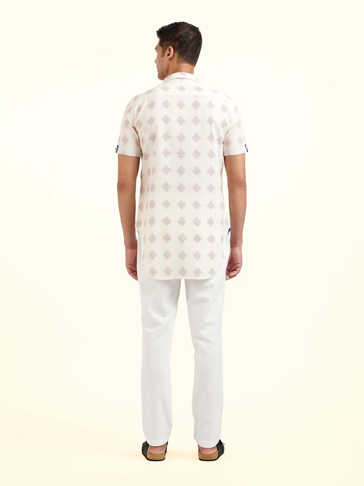 Back view of white cotton Telangana Ikat shirt displaying overall design