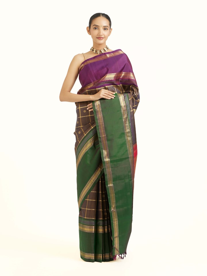 Front view of black silk Kancheepuram saree with rich zari woven motifs