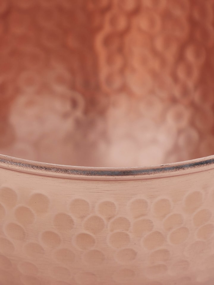 Detailed view of Copper Fruit Bowl showcasing its polished copper finish and fine detailing.